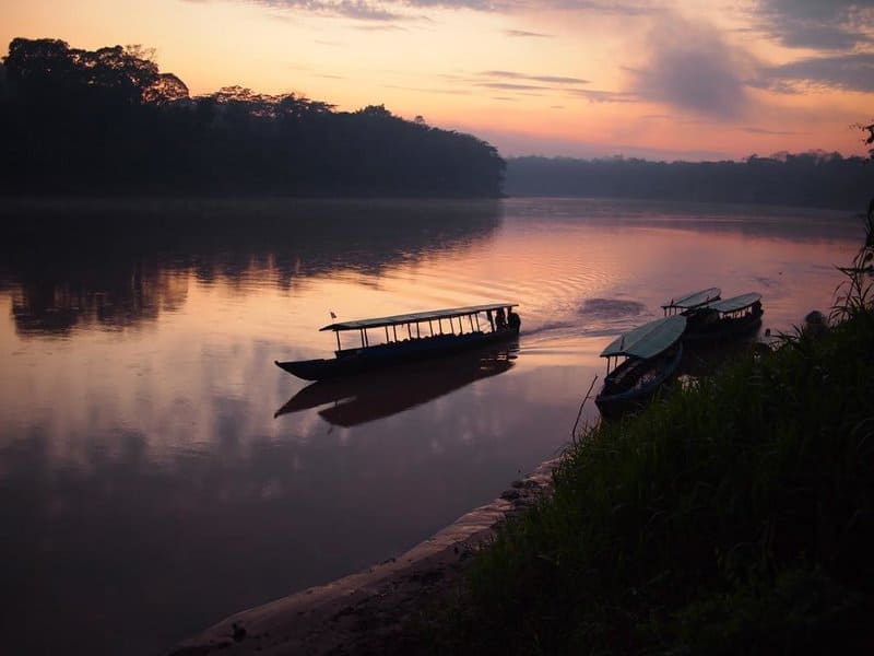 Riverboats on River in Tambopata National Reserve in Peruvian Amazon Jungle